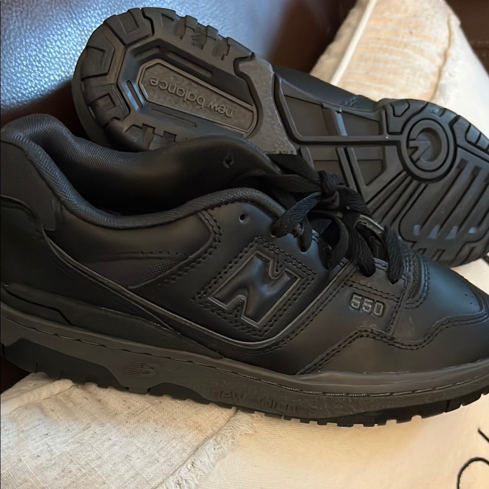 New Balance Black Sneakers with Rugged Tread and Cushioned Midsole